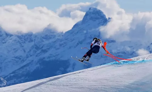 FILE - United States' Lindsey Vonn crashes into a gate during an alpine ski women's downhill race, at the 2026 Winter Olympics, in Cortina d'Ampezzo, Italy, Sunday, Feb. 8, 2026. (AP Photo/Jacquelyn Martin, File)