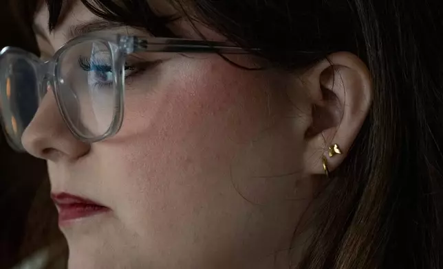 Kate poses for a portrait in her apartment in Kentucky, Wednesday, Dec. 10, 2025. (AP Photo/Michael Swensen)