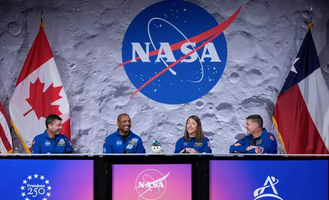 NASA's Artemis II crew - NASA astronauts Reid Wiseman, Victor Glover, and Christina Koch, and Canadian Space Agency (CSA) astronaut Jeremy Hansen speak during a press conference on Thursday, April 16, 2026, in Houston. (AP Photo/Ashley Landis)