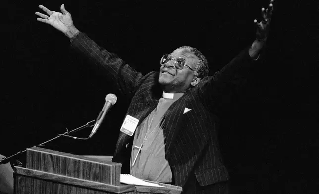 FILE - South African Bishop Desmond Tutu denounces his country's apartheid policy of racial separation in New Orleans, Sept. 7, 1982. (AP Photo/Jack Thornell, File)