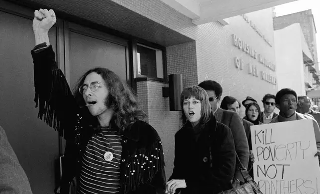 FILE - Actress Jane Fonda, center, joins the picket line with marchers in support of a group of black militant squatters whom police have tried to evict form city-owned apartments in New Orleans, Nov. 3, 1970. (AP Photo/Jack Thornell, File)