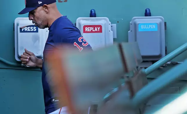 Boston Red Sox' manager Alex Cora heads from the dugout to the clubhouse before a baseball game against the Detroit Tigers, Monday, April 20, 2026 in Boston. (AP Photo/Jim Davis)