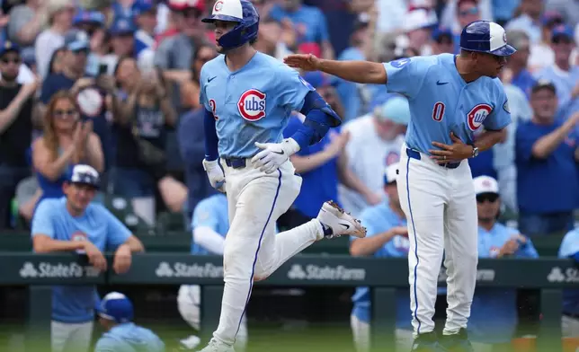 Chicago Cubs' Nico Hoerner (2) runs the bases after hitting a two-run home run during the second inning of a baseball game against the New York Mets, Friday, April 17, 2026, in Chicago. (AP Photo/Erin Hooley)