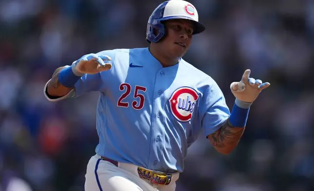 Chicago Cubs designated hitter Moises Ballesteros (25) runs the bases after hitting a three-run home run during the first inning of a baseball game against the New York Mets, Friday, April 17, 2026, in Chicago. (AP Photo/Erin Hooley)