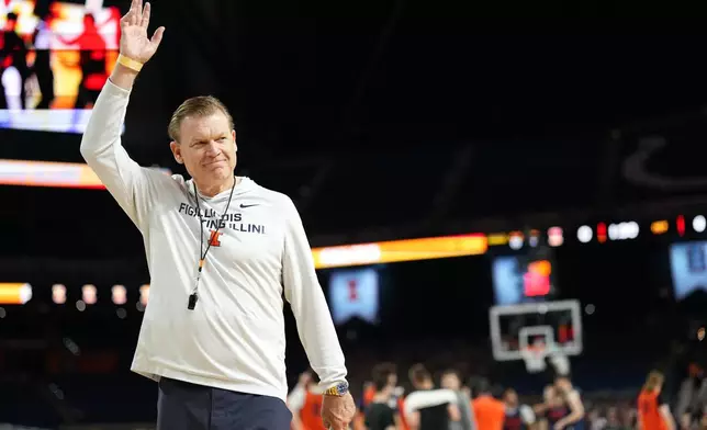 Illinois head coach Brad Underwood waves during practice ahead of a national semifinal NCAA college basketball tournament game against UConn at the Final Four, Friday, April 3, 2026, in Indianapolis. (AP Photo/Abbie Parr)