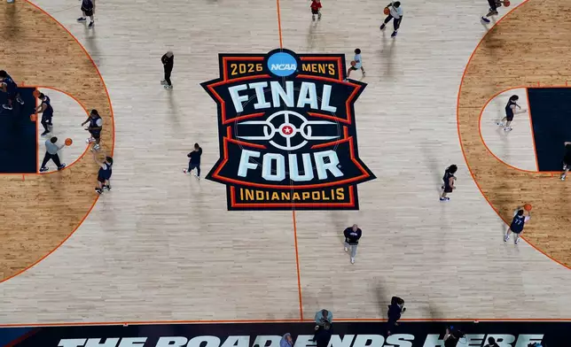 UConn players run drills during practice ahead of a national semifinal NCAA college basketball tournament game against Illinois at the Final Four, Friday, April 3, 2026, in Indianapolis. (AP Photo/Jeff Roberson)