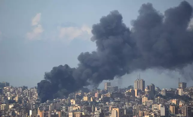 Smoke rises following an Israeli airstrike on a building in Beirut, Lebanon, Wednesday, April 8, 2026. (AP Photo/Hassan Ammar)