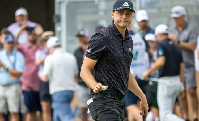 Ludvig Aberg waves to fans during the second round of the Valero Texas Open golf tournament in San Antonio, Friday, April 3, 2026. (Andrew J. Whitaker/The San Antonio Express-News via AP)