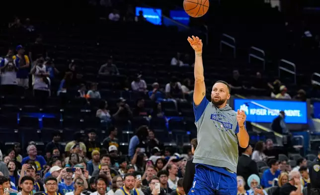 Golden State Warriors guard Stephen Curry warms up before an NBA basketball game against the Houston Rockets, Sunday, April 5, 2026, in San Francisco. (AP Photo/Godofredo A. Vásquez)