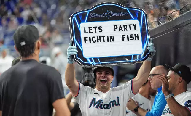 Miami Marlins' Jakob Marsee celebrates after hitting a home run during the first inning of a baseball game against the St. Louis Cardinals, Tuesday, April 21, 2026, in Miami. (AP Photo/Rebecca Blackwell)
