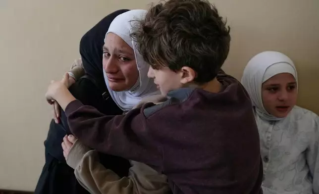 Relatives of Ghadir Baalbaki, 19, who was killed on Tuesday in an Israeli airstrike, mourn during her funeral in the southern port city of Tyre, Lebanon, Wednesday, April 15, 2026. (AP Photo/Hussein Malla)