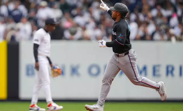 Miami Marlins' Xavier Edwards (9) rounds the bases after hitting a home run during the first inning of the New York Yankees' home-opener baseball game, Friday, April 3, 2026, in New York. (AP Photo/Yuki Iwamura)