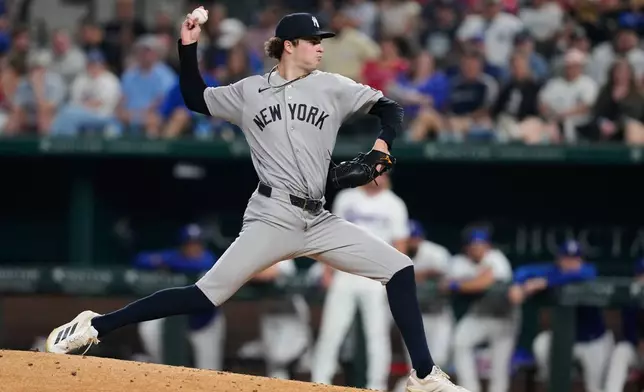New York Yankees pitcher Cam Schlittler throws to the Texas Rangers in the fourth inning of a baseball game Tuesday, April 28, 2026, in Arlington, Texas. (AP Photo/Tony Gutierrez)