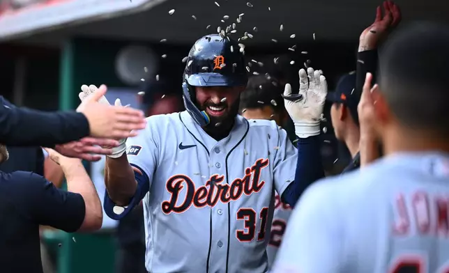 Detroit Tigers' Riley Greene celebrates after his solo home run with teammates during the second inning of a baseball game against the Cincinnati Reds in Cincinnati, Friday, April 24, 2026. (AP Photo/Ben Jackson)