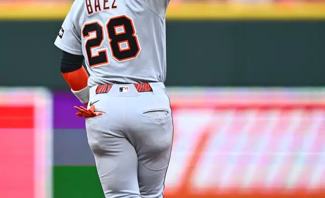 Detroit Tigers' Javier Báez celebrates after hitting a solo home run during the third inning of a baseball game against the Cincinnati Reds in Cincinnati, Friday, April 24, 2026. (AP Photo/Ben Jackson)