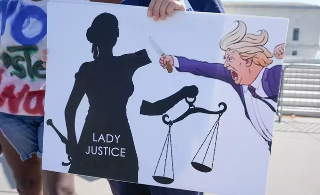 Demonstrators rally outside the U.S. Supreme Court as justices hear oral arguments on whether President Donald Trump can deny citizenship to children born to parents who are in the United States illegally or temporarily, on Capitol Hill, in Washington, Wednesday, April 1, 2026. (AP Photo/Mariam Zuhaib)