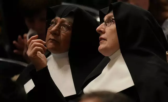 Nuns wait for Pope Leo XIV Easter Vigil inside St. Peter's Basilica at The Vatican, Saturday, April 4, 2026. (AP Photo/Andrew Medichini)