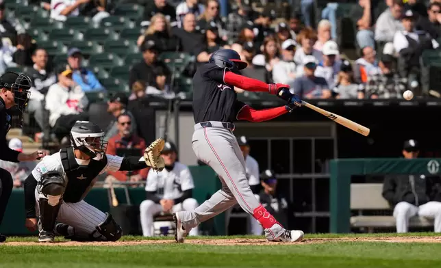 Washington Nationals' José Tena hits a solo home run during the 10th inning of a baseball game against the Chicago White Sox in Chicago, Sunday, April 26, 2026. (AP Photo/Nam Y. Huh)