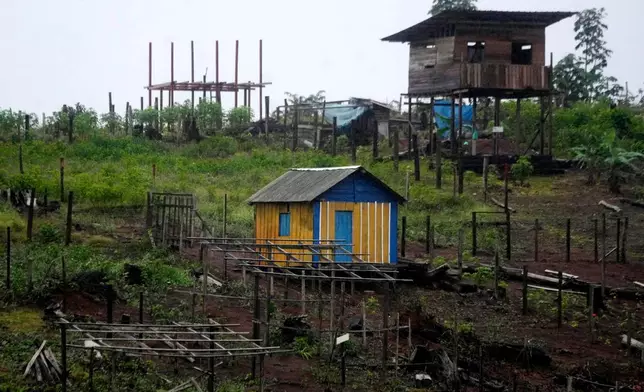 Construction is visible in an area known as Nova Conquista or New Conquest where families are building houses near the center of Oiapoque, Amapa state, Brazil, Wednesday, March 11, 2026. (AP Photo/Eraldo Peres)