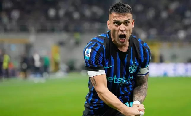 Inter Milan's Lautaro Martinez celebrates after scoring his side's opening goal during the Serie A soccer match between Inter Milan and Roma in Milan, Italy, Sunday, April 5, 2026. (AP Photo/Luca Bruno)
