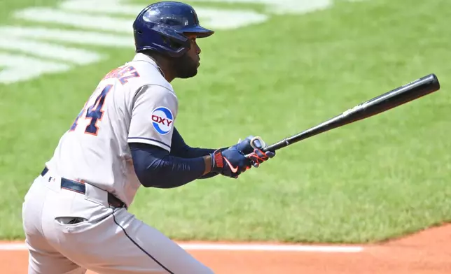 Houston Astros' Yordan Alvarez singles in the third inning of a baseball game against the Cleveland Guardians in Cleveland, Wednesday, April 22, 2026. (AP Photo/David Richard)