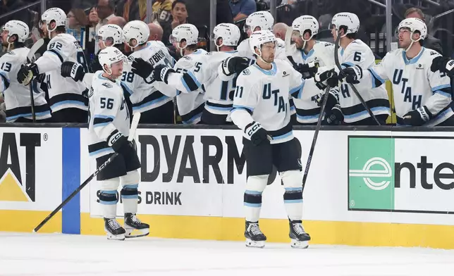 Utah Mammoth right wing Dylan Guenther (11), reacts after his goal against the Vegas Golden Knights during the second period in Game 2 of a first-round NHL hockey Stanley Cup playoff series Tuesday, April 21, 2026, in Las Vegas. (AP Photo/Ian Maule)