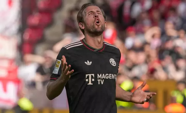 Bayern's Harry Kane reacts during a Bundeliga soccer match between Mainz and Bayern in Mainz,Germany, Saturday, April 25, 2026. (AP Photo/Michael Probst)