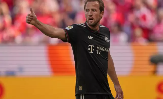 Bayern's Harry Kane reacts during a Bundeliga soccer match between Mainz and Bayern in Mainz,Germany, Saturday, April 25, 2026. (AP Photo/Michael Probst)