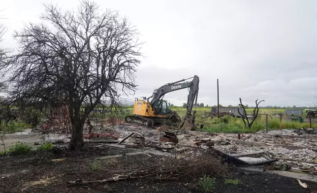 Property damage is shown at the location of a July 1, 2025, fireworks explosion in Esparto, Calif., Friday, April 10, 2026. (AP Photo/Jeff Chiu)