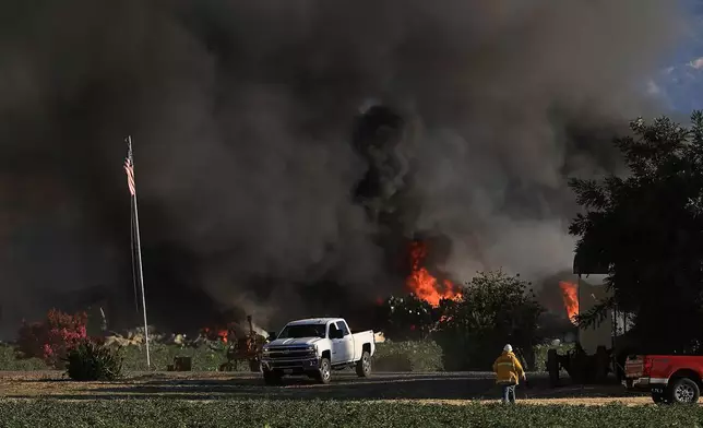 Smoke and flames rise during a fireworks warehouse explosion near Esparto, Calif., Tuesday, July 1, 2025. (Kent Porter/The Press Democrat via AP, File)