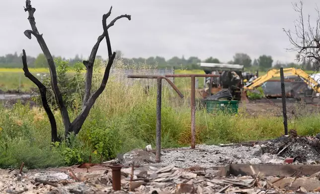 Property damage is shown at the location of a July 1, 2025, fireworks explosion in Esparto, Calif., Friday, April 10, 2026. (AP Photo/Jeff Chiu)