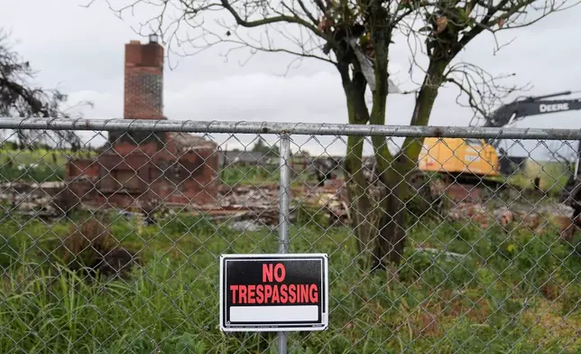A No Trespassing sign hangs on a fence outside the location of a July 1, 2025, fireworks explosion in Esparto, Calif., Friday, April 10, 2026. (AP Photo/Jeff Chiu)