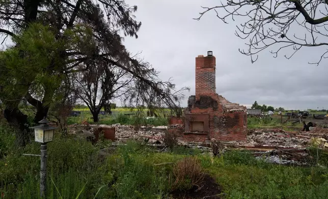 Property damage is shown at the location of a July 1, 2025, fireworks explosion in Esparto, Calif., Friday, April 10, 2026. (AP Photo/Jeff Chiu)