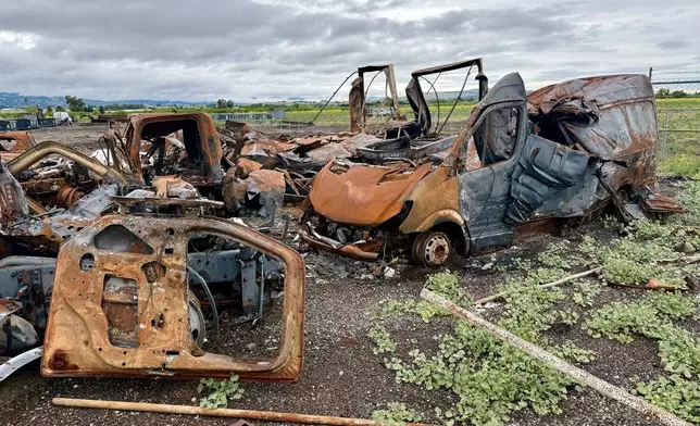 Damaged vehicles are shown at the location of a July 1, 2025, fireworks explosion in Esparto, Calif., Friday, April 10, 2026. (AP Photo/Haven Daley)