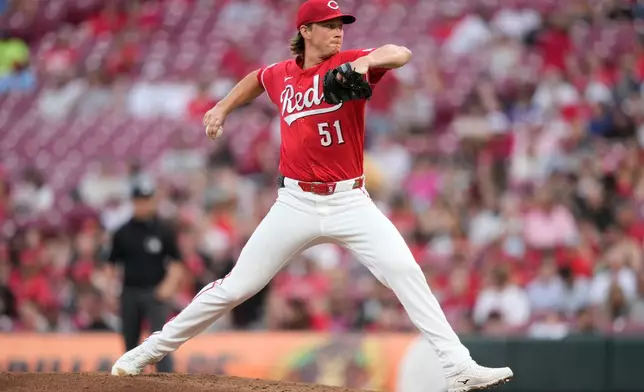 Cincinnati Reds pitcher Brady Singer throws during the third inning of a baseball game against the San Francisco Giants in Cincinnati, Tuesday, April 14, 2026. (AP Photo/Carolyn Kaster)