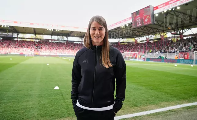 New head coach of German Bundesliga soccer club 1. FC Union Berlin Marie-Louise Eta looks on during the warm up prior to the German Bundesliga soccer match between FC Union Berlin and Wolfsburg in Berlin, Germany, Saturday, April 18, 2026. (AP Photo/Ebrahim Noroozi)