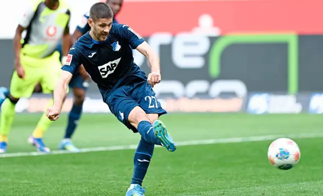 Hoffenheim's Andrej Kramaric scores a penalty during their German Bundesliga soccer match against Borussia Dortmund in Sinsheim, Germany, Saturday, April 18, 2026. (Uwe Anspach/dpa via AP)