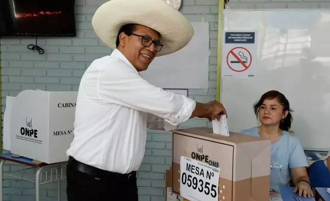 Roberto Sanchez, presidential candidate of Together for Peru party, votes during general elections in Lima, Peru, Sunday, April 12, 2026. (AP Photo/Isabel Dueñas)