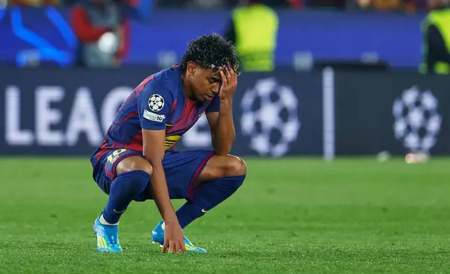 Barcelona's Lamine Yamal reacts disappointed after the Champions League quarterfinal first leg soccer match between Barcelona and Atletico Madrid in Barcelona, Spain, Wednesday, April 8, 2026. (AP Photo/Joan Monfort)