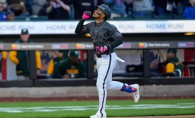 New York Mets' Jorge Polanco reacts after hitting a home run during the seventh inning of a baseball game against the Athletics, Saturday, April 11, 2026, in New York. (AP Photo/Yuki Iwamura)
