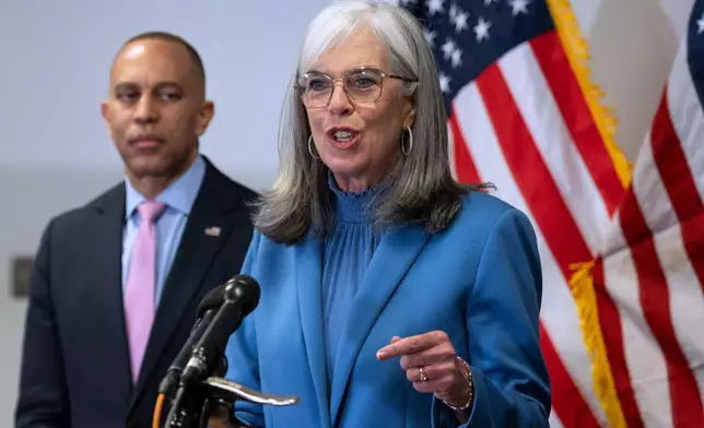 House Minority Leader Hakeem Jeffries, D-N.Y., left, looks on as House Democratic Whip Katherine Clark, D-Mass., speaks about Virginia's redistricting vote, at the Democratic National Committee headquarters in Washington, Wednesday, April 22, 2026. Virginia voters approved a congressional redistricting plan that could help Democrats win up to four additional U.S. House seats in this year's midterm elections. (AP Photo/Cliff Owen)