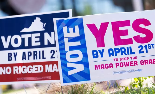 Signs are seen outside Fairfax Government Center during the Virginia redistricting referendum, Tuesday, April 21, 2026, in Fairfax, Va. (AP Photo/Julia Demaree Nikhinson)