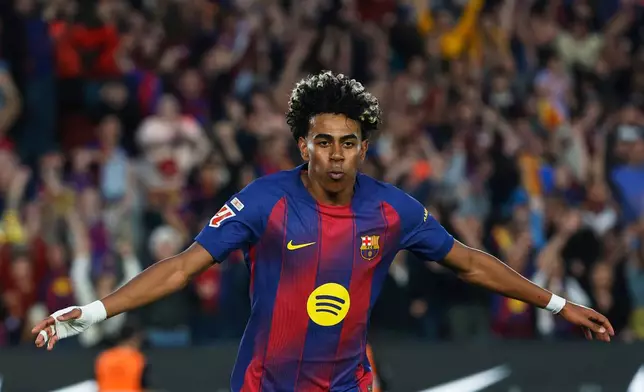 Barcelona's Lamine Yamal celebrates after scoring his side's third goal during the Spanish La Liga soccer match between Barcelona and Espanyol in Barcelona, Spain, Saturday, April 11, 2026. (AP Photo/Joan Monfort)