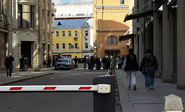 Activists gather outside a presidential administration building, in Moscow, Saturday, April 4, 2026, to sign a petition against internet restrictions. (AP Photo)