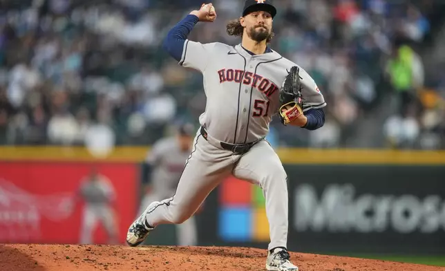 Houston Astros relief pitcher Ryan Weiss throws against the Seattle Mariners during the third inning of a baseball game, Friday, April 10, 2026, in Seattle. (AP Photo/Lindsey Wasson)