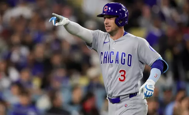 Chicago Cubs' Alex Bregman reacts after hitting the tying solo home run during the eighth inning of a baseball game against the Los Angeles Dodgers Friday, April 24, 2026, in Los Angeles. (AP Photo/Ryan Sun)