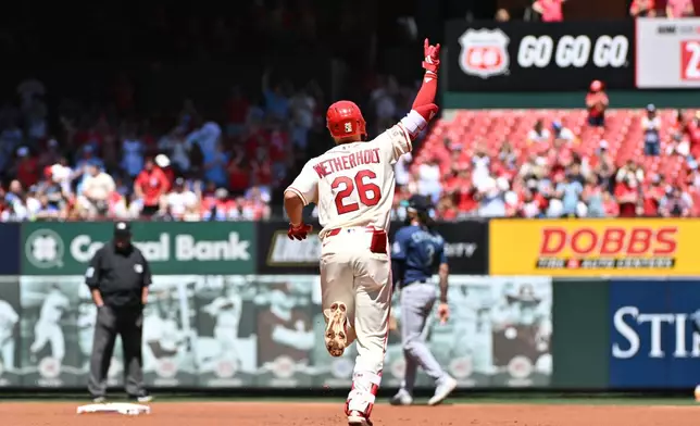 St. Louis Cardinals shortstop JJ Wetherholt reacts as he rounds the bases after hitting a home run against the Seattle Mariners during the first inning of a baseball game, Saturday, April 25, 2026, in St. Louis. (AP Photo/Jeff Le)