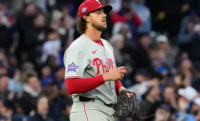 Philadelphia Phillies starting pitcher Aaron Nola reacts after Chicago Cubs' Dansby Swanson hit a three-run home run during the second inning of a baseball game, in Chicago, Monday, April 20, 2026. (AP Photo/Nam Y. Huh)