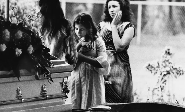FILE - Mourners say goodbye to Kimberly Leach at her funeral, April 13, 1978, in Lake City, Fla. (AP Photo, File)