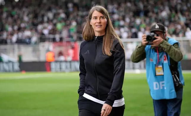 New head coach of German Bundesliga soccer club 1. FC Union Berlin Marie-Louise Eta looks on during the warm up prior to the German Bundesliga soccer match between FC Union Berlin and Wolfsburg in Berlin, Germany, Saturday, April 18, 2026. (AP Photo/Ebrahim Noroozi)